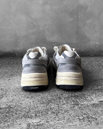 Golden Goose Dad-Star sneakers in suede and silver mesh, combining retro-inspired style with signature distressed detailing.