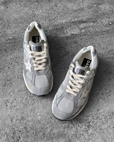 Golden Goose Dad-Star sneakers in suede and silver mesh, combining retro-inspired style with signature distressed detailing.