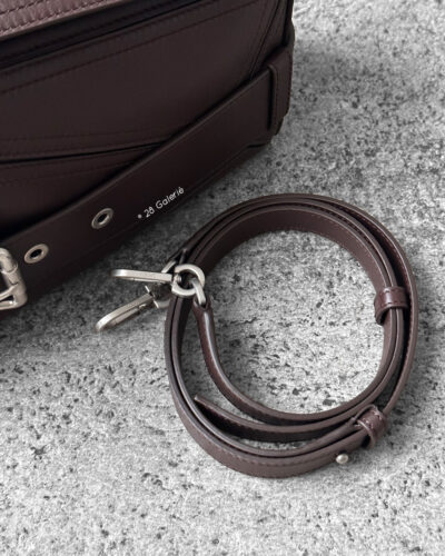 Loewe Small Dark Brownie Puzzle Biker Bag in calfskin leather, blending the iconic Puzzle design with bold biker-inspired detailing.