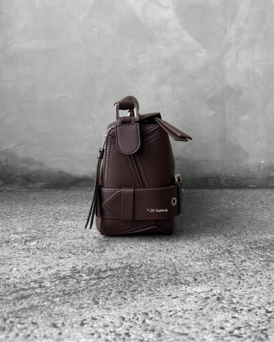 Loewe Small Dark Brownie Puzzle Biker Bag in calfskin leather, blending the iconic Puzzle design with bold biker-inspired detailing.