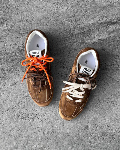 Miu Miu x New Balance 530 SL sneakers in cinnamon suede leather, merging sporty design with luxury craftsmanship.