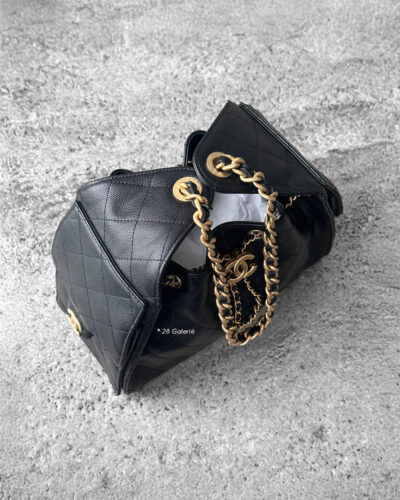 Small Black C25 Quilted Caviar bag with aged gold-tone hardware. A classic, compact design that exudes timeless elegance and versatile style.