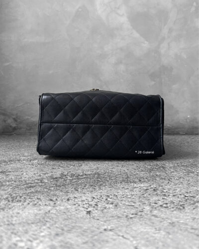 Small Black C25 Quilted Caviar bag with aged gold-tone hardware. A classic, compact design that exudes timeless elegance and versatile style.