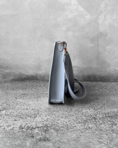 Hermès Bleu Glacier Evelyne 16 Amazone Bag, a compact crossbody in Clemence leather with signature perforated H logo and canvas strap.