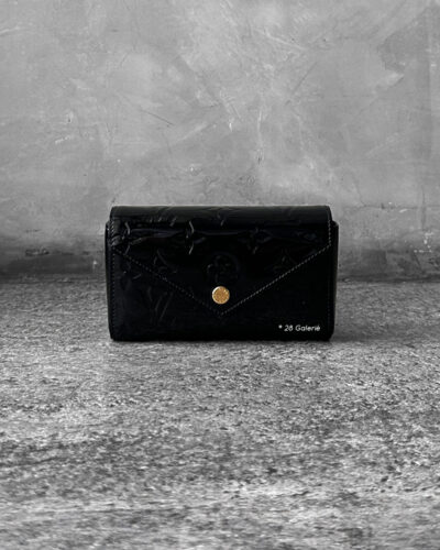 Louis Vuitton Black Patent Pochette Lucy Monogram Vernis Pouch, a sleek and compact design in glossy patent leather with timeless LV elegance.