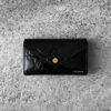 Louis Vuitton Black Patent Pochette Lucy Monogram Vernis Pouch, a sleek and compact design in glossy patent leather with timeless LV elegance.