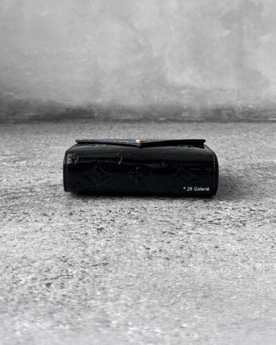 Louis Vuitton Black Patent Pochette Lucy Monogram Vernis Pouch, a sleek and compact design in glossy patent leather with timeless LV elegance.