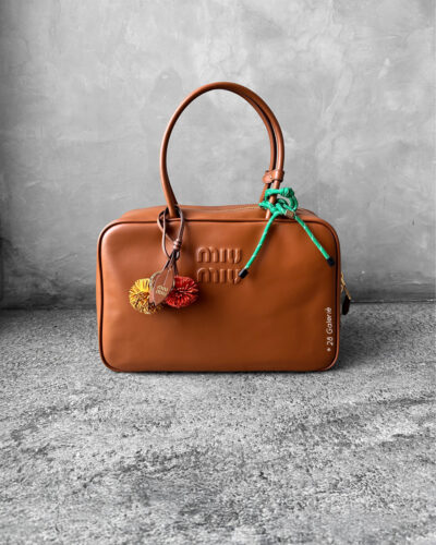 Miu Miu Cognac Large Leather Beau Bag, a structured and spacious design that blends timeless elegance with modern sophistication.