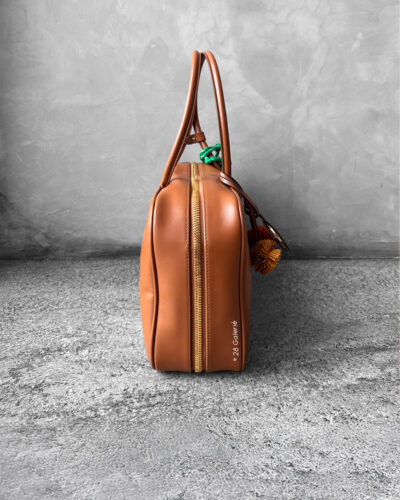 Miu Miu Cognac Large Leather Beau Bag, a structured and spacious design that blends timeless elegance with modern sophistication.
