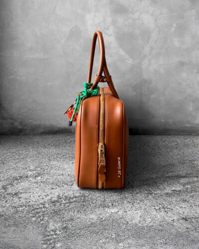 Miu Miu Cognac Large Leather Beau Bag, a structured and spacious design that blends timeless elegance with modern sophistication.