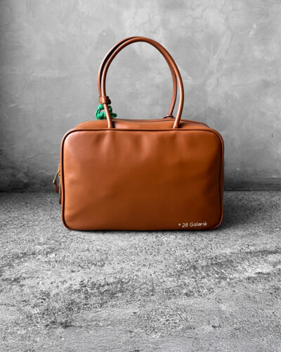 Miu Miu Cognac Large Leather Beau Bag, a structured and spacious design that blends timeless elegance with modern sophistication.