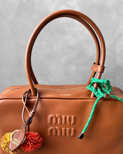 Miu Miu Cognac Large Leather Beau Bag, a structured and spacious design that blends timeless elegance with modern sophistication.
